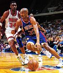 Grant Hill drives past Chris...